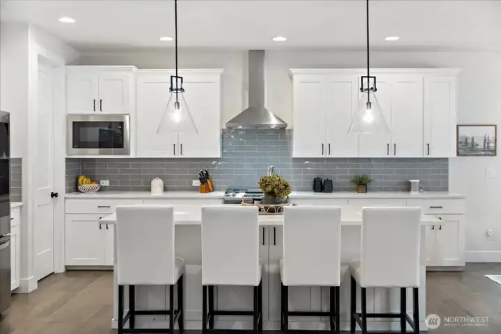 Spacious walk-in pantry provides ample room to organize small appliances, pantry staples and gourmet ingredients-keeping the kitchen beautifully functional and clutter-free.
