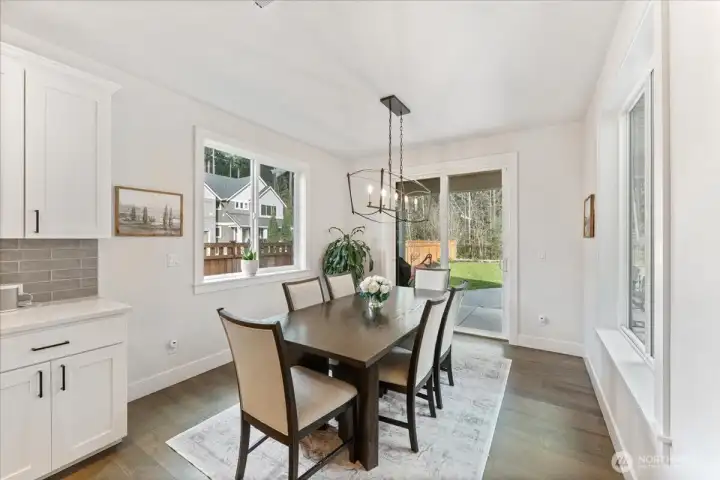 Formal Dining Space with stylish lighting that opens to a covered patio-ideal for everyday enjoyment.