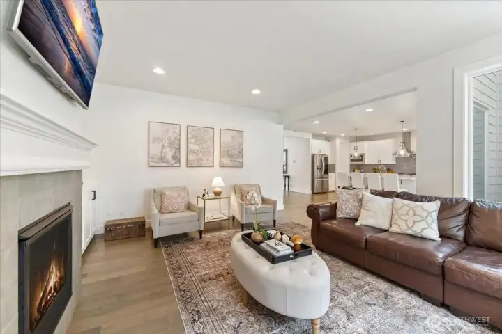 A perspective showcasing the open, functional layout of the kitchen flowing into the family room, ideal for style and entertaining.