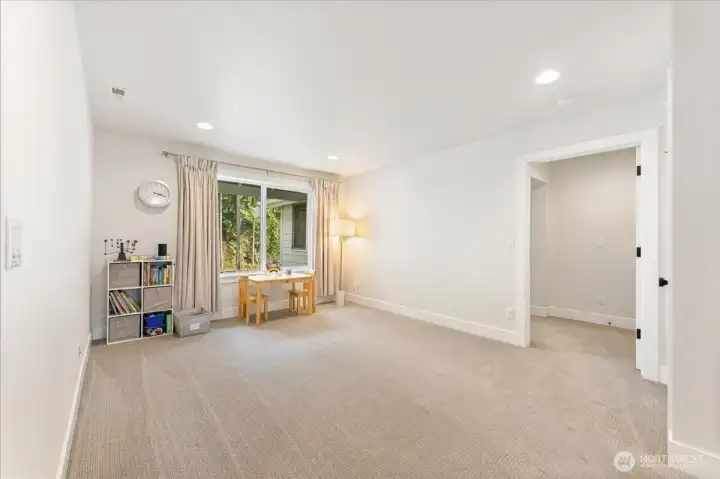 At the top of the stairs, a spacious open loft unfolds, offering a versatile area perfect for a home office, playroom,   media space,or casual gathering area, adaptable to your lifestyle needs.