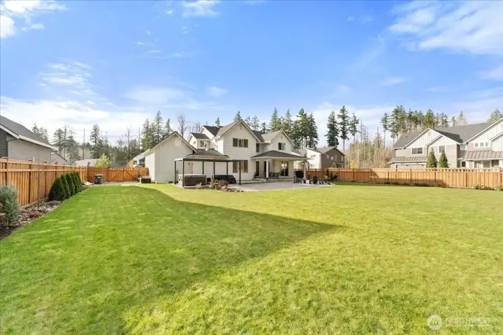 An unbelievable level 17,000 sq ft lot provides a rare opportunity for space privacy, and outdoor enjoyment.  Fully fenced and enhanced with a sprinkler system, this lush property backs to a serene greenbelt creating a private,park-like setting for family living, entertaining, and landscaping dreams.