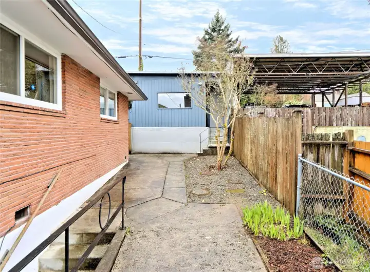 North side yard with separate entrance to basement. Detached garage also accessible from alley.