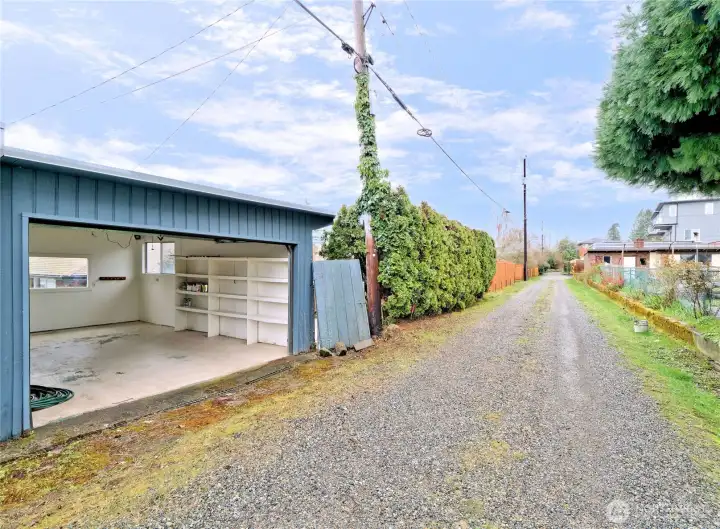 Alley access to large garage with newer roof.