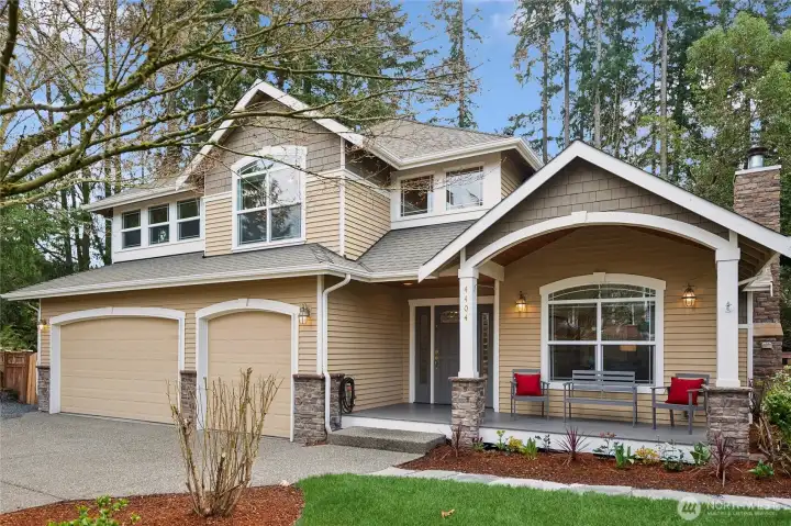 Enter through the covered deck through glassed accent entry door and sidelights into...