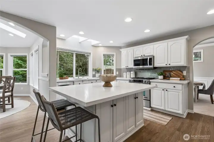 SS appliances include Bosch Dishwasher, JennAir Range, Microwave and a brand-new LG smart refrigerator. Abundant recessed lighting enhances the space, while the island offers seating, prep and serving functionality with generous cabinetry on each side of the island.