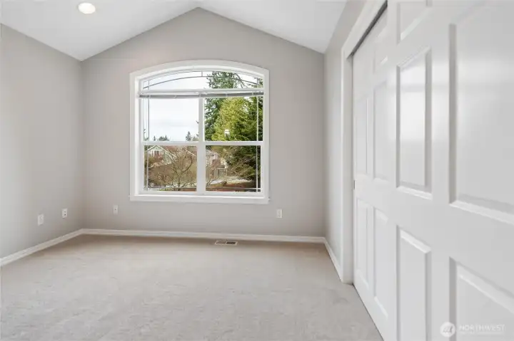 Down the adjacent hallway, the secondary bedrooms are well sized and designed, including one featuring vaulted ceiling and large picture window overlooking the front yard. Each bedroom offers a spacious closet with bypass doors, new carpeting, pad and freshly painted walls, ceiling, doors and millwork.