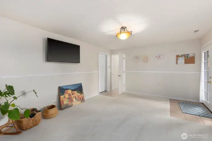 Rec room or second living space has French doors leading to a patio and backyard as well as access to the garage Rec room or second living space has French doors leading to a patio and backyard as well as access to the garage
