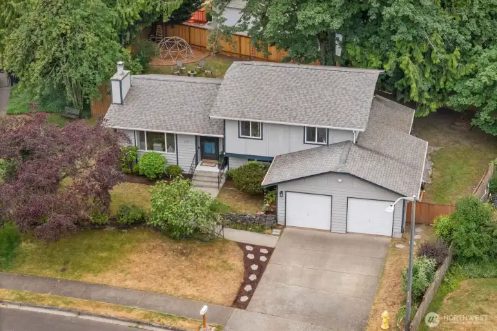 Overall view of the home, yard and beautiful maple tree that will provide shade on the hot afternoons Overall view of the home, yard and beautiful maple tree that will provide shade on the hot afternoons
