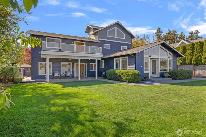 Gracefully positioned on a level lot, this stunning home offers over 3600 square feet of living space and direct access to serene low bank waterfront.