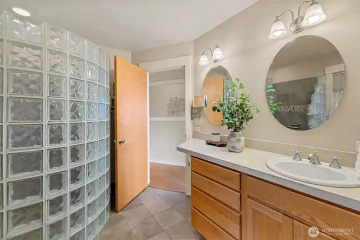 Step into a lavish primary bathroom conveniently located just off the main floor's primary bedroom.