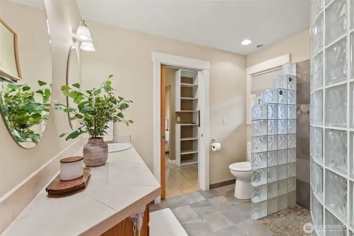 Step into a lavish primary bathroom conveniently located just off the main floor's primary bedroom