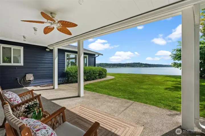 Primary patio off sitting room with wet bar with peaceful water views. Primary patio off sitting room with wet bar with peaceful water views.
