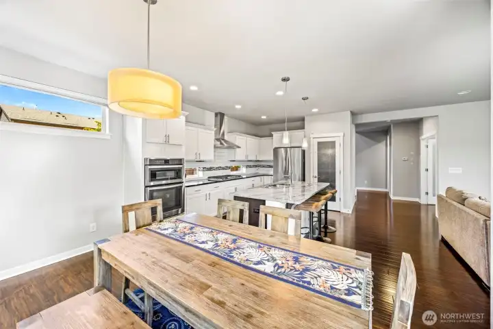 Dining is right next to kitchen and joins the covered patio which could be outside dining space