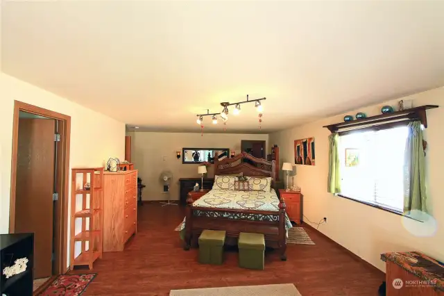 Looking from the sliding door toward the back of the primary bedroom.