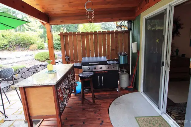 The dining room sliding door leading to the covered deck perfect for barbequing and entertaining guests.