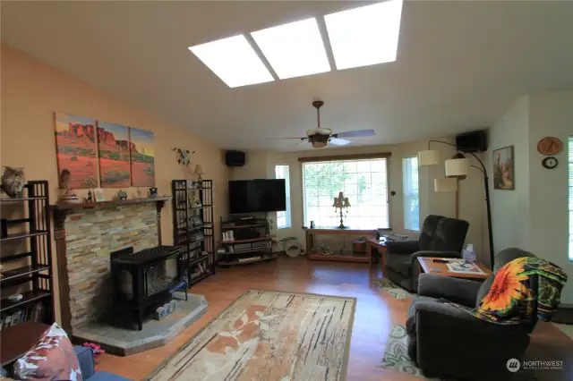 This inviting space combines comfort with stunning natural scenery, with views of the Hood Canal.  The windows and skylights fill the space with natural light.