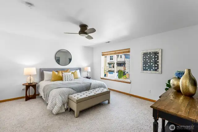 The primary suite is very large and has plenty of room for a King sized bed and large bed side tables.