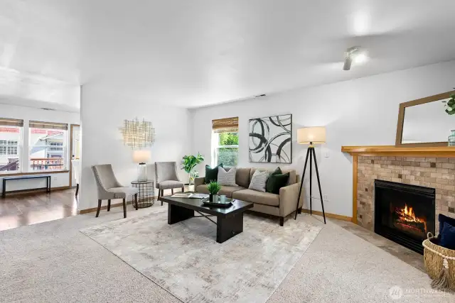 The large living room features a gas fireplace and ample space for different furniture configurations.