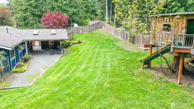 Partial back yard view, fully fenced yard