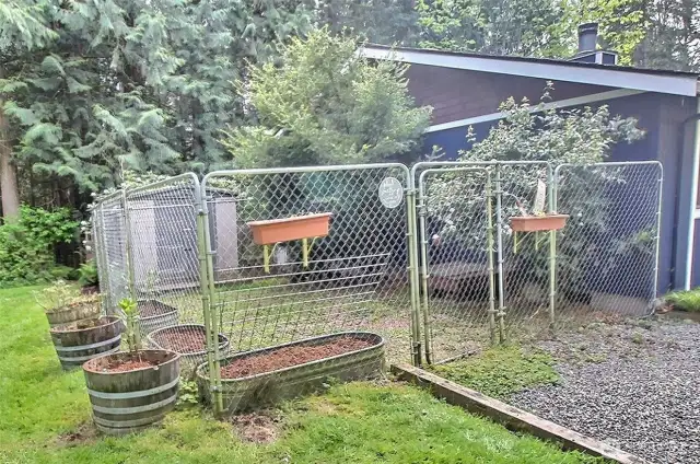 Dog run on the side of the home. there is a door from bedroom #2 directly to this dog run.