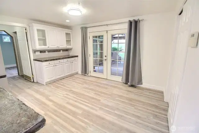 Adjacent to the kitchen your dining area with built-in cabinetry.