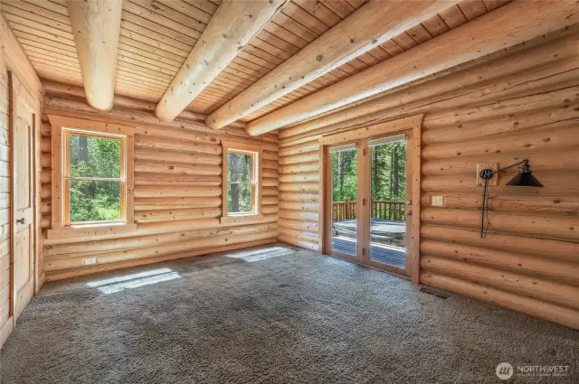 Main floor bedroom opens to deck
