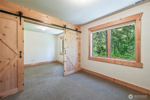 Two rooms connected by barndoors
