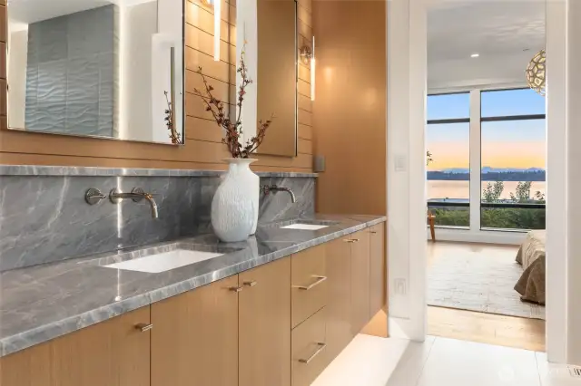 Luxurious Primary Bath With Slab Counters, Custom Rift Oak FloatingCabinets and Wall Detail