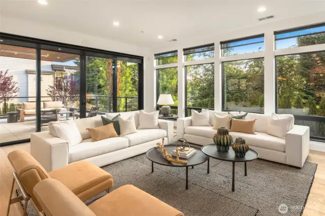 10 Feet Ceilings throughout the main floor floods the great room spaces with natural light.Lutron Lighting Control at Selected Locations. Lutron Motorized Window Shades Furnished and Installed at Primary, Guest, Dining, and Great Room