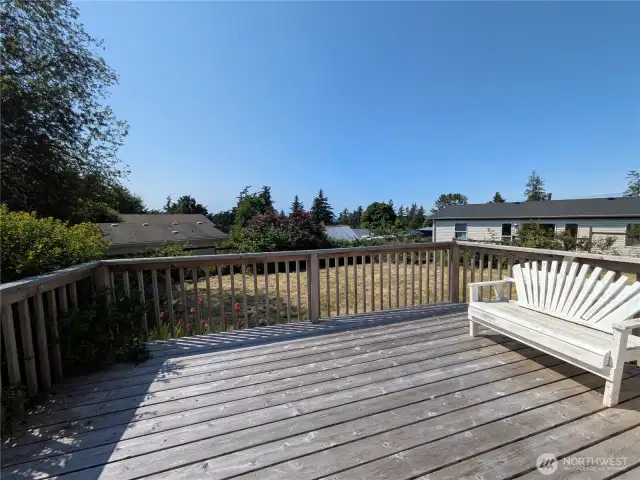 Enjoy peek-a-boo ocean view from the deck.