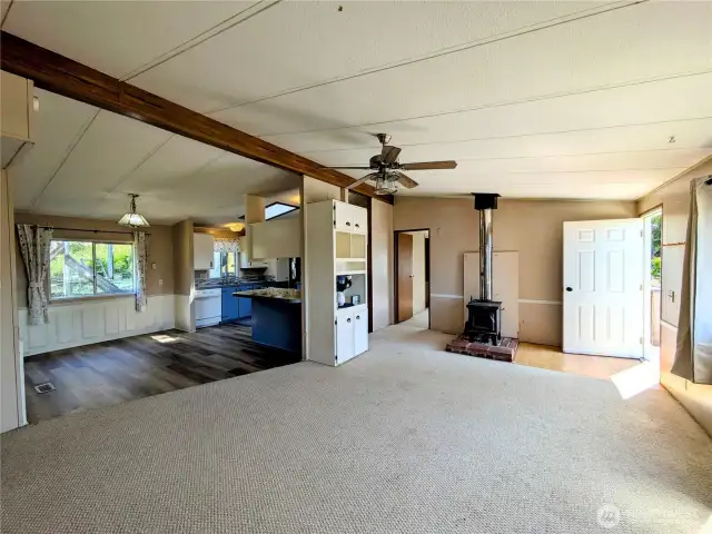 Large living room with wood stove.
