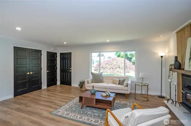 Beautiful doors with fine brass finishes complement the home.