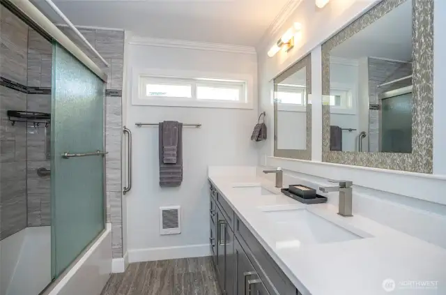 The guest bath has been updated with new lighting, cabinetry, mirrors, and Quartz counters. It also includes a large walk-in shower and a bathtub. We hope your guests enjoy it!