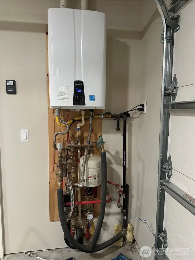 Tankless water heater provides radiant floor heat for the whole house