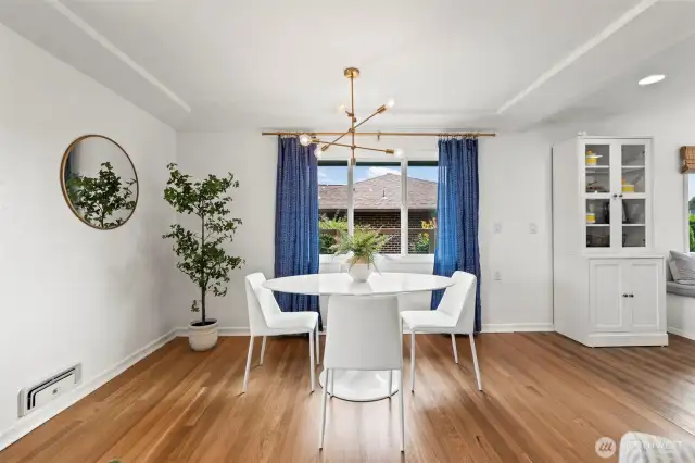 The living space flows seamlessly into the dining area, perfect for entertaining.