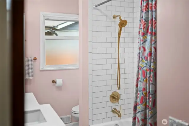 A beautiful paint palette and modern finishes create a fresh, inviting bathroom.