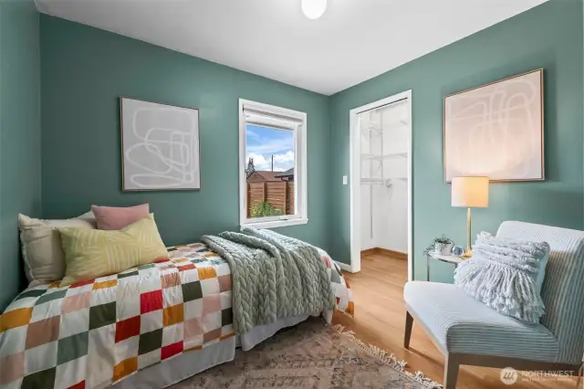 The third bedroom offers a peaceful backyard view through its rear-facing window.