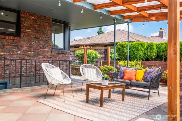 Enjoy a secluded backyard with a spacious covered patio and beautifully crafted custom fencing (installed in 2020).