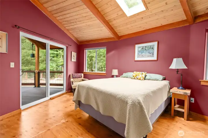 Guest bedroom  with access out to the deck.