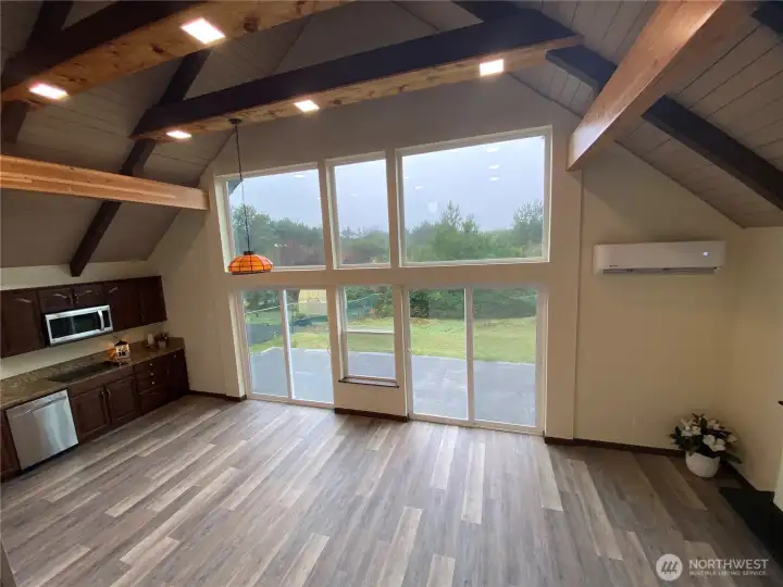 from the loft area looking toward kitchen. All windows and sliding doors are brand new!
