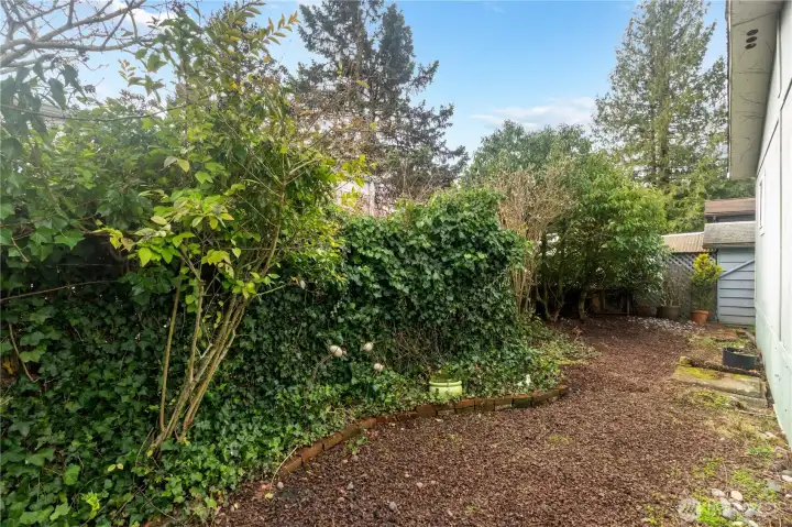 Beautiful fenced in backyard garden area