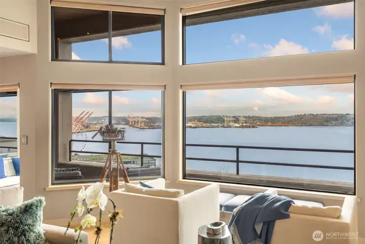 Mesmerizing views of the Olympics and Sound from the living, dining, and office areas.