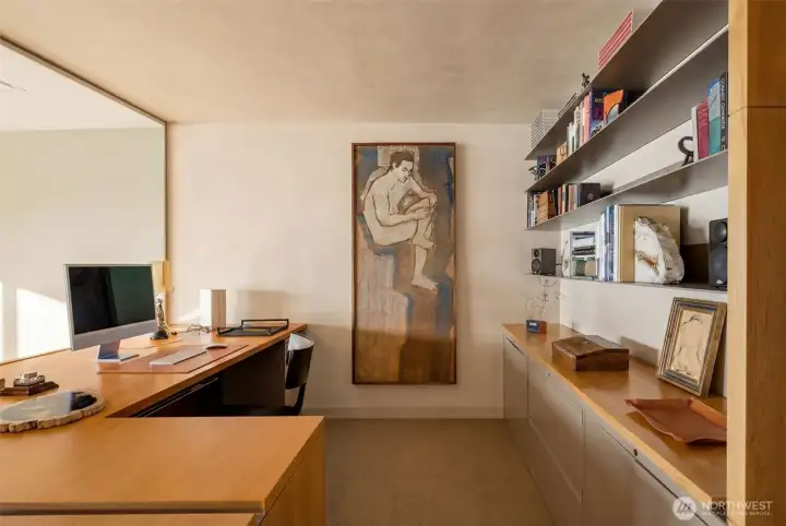 Walnut desk and counter, Knoll cabinets, 1/4" custom metal book shelves, locking drawers, diamond coat plastered walls around .