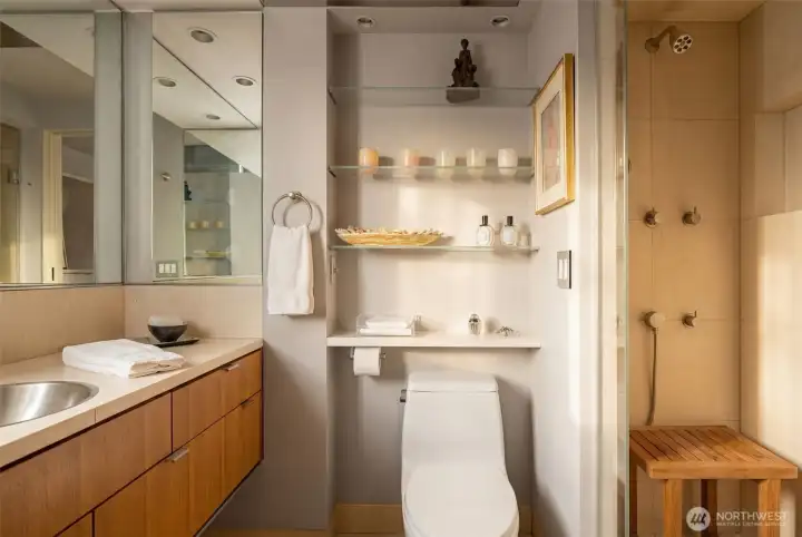 Primary bathroom features marble stone counters, heated floors, premium fixtures, stainless medicine cabinet and sink, and outlets inside the medicine cabinet and drawers.