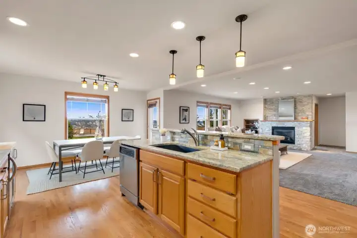 Kitchen flows easily into everyday dining area and family room.