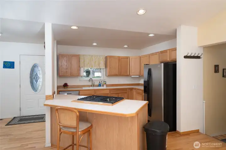 Kitchen peninsula offers additional seating.