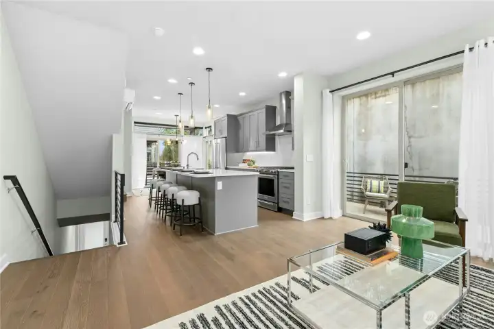 This open-concept living room, kitchen, and dining offer the perfect layout for entertaining guests and having get togethers!