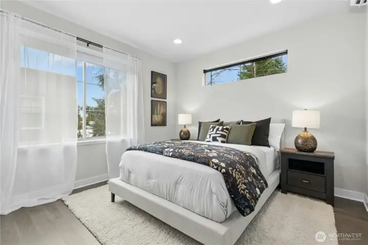 Primary suite with 3 closets, and en-suite bath.