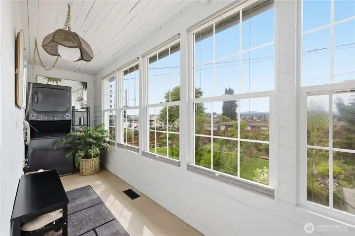 Enter through the side door to a light filled room houses the washer and dryer.