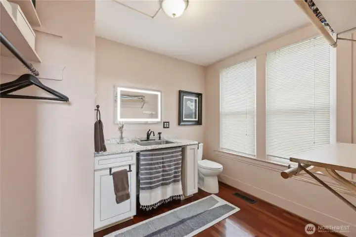 Off from the bedroom is a 1/2 bathroom. There is room to insert a shower if one wishes.